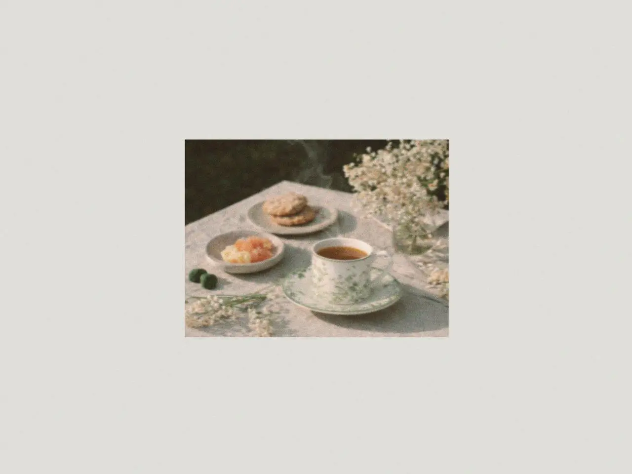 Lily of the valley ceramic mug and saucer with tea and desserts arranged on a linen table, a charming mug gift set and thoughtful lily of the valley gifts for spring gatherings.