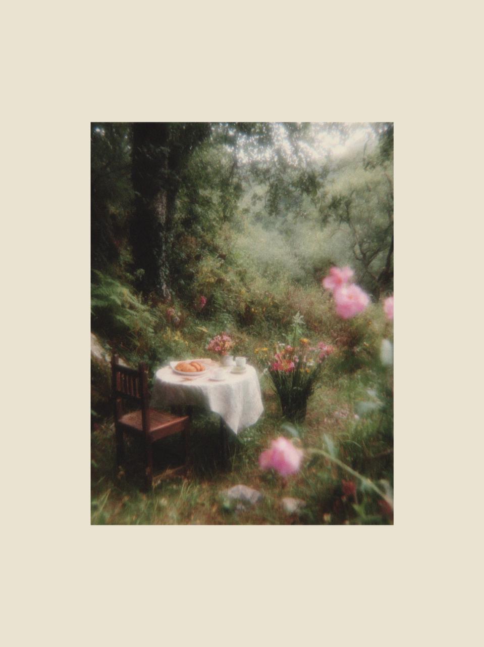 small outdoor table set among flowers in a green garden during early springtime creating a calm seasonal dining scene.